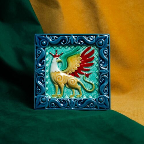 Изразец Грифон цветной синий фон фото