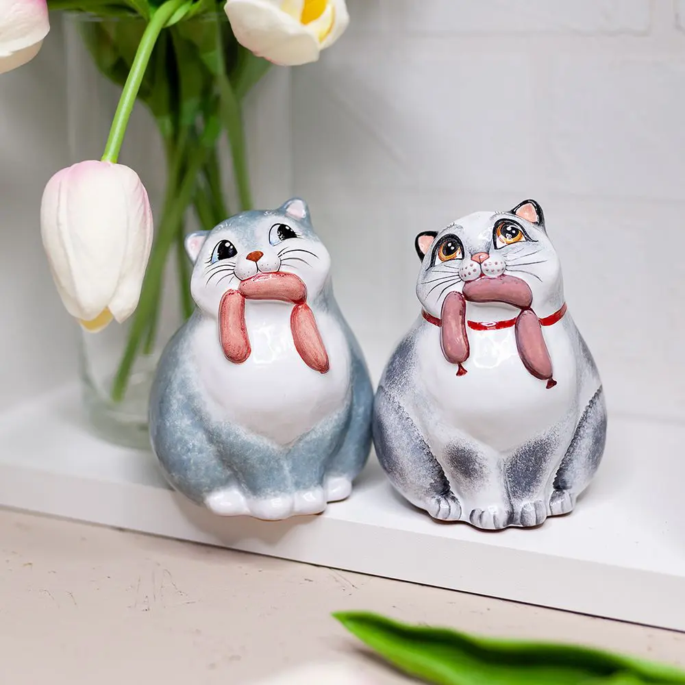 Кот с сосисками
