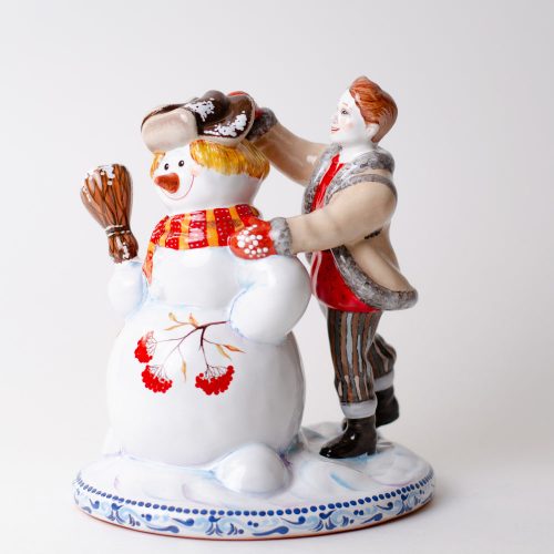 Мальчик и снеговик фото